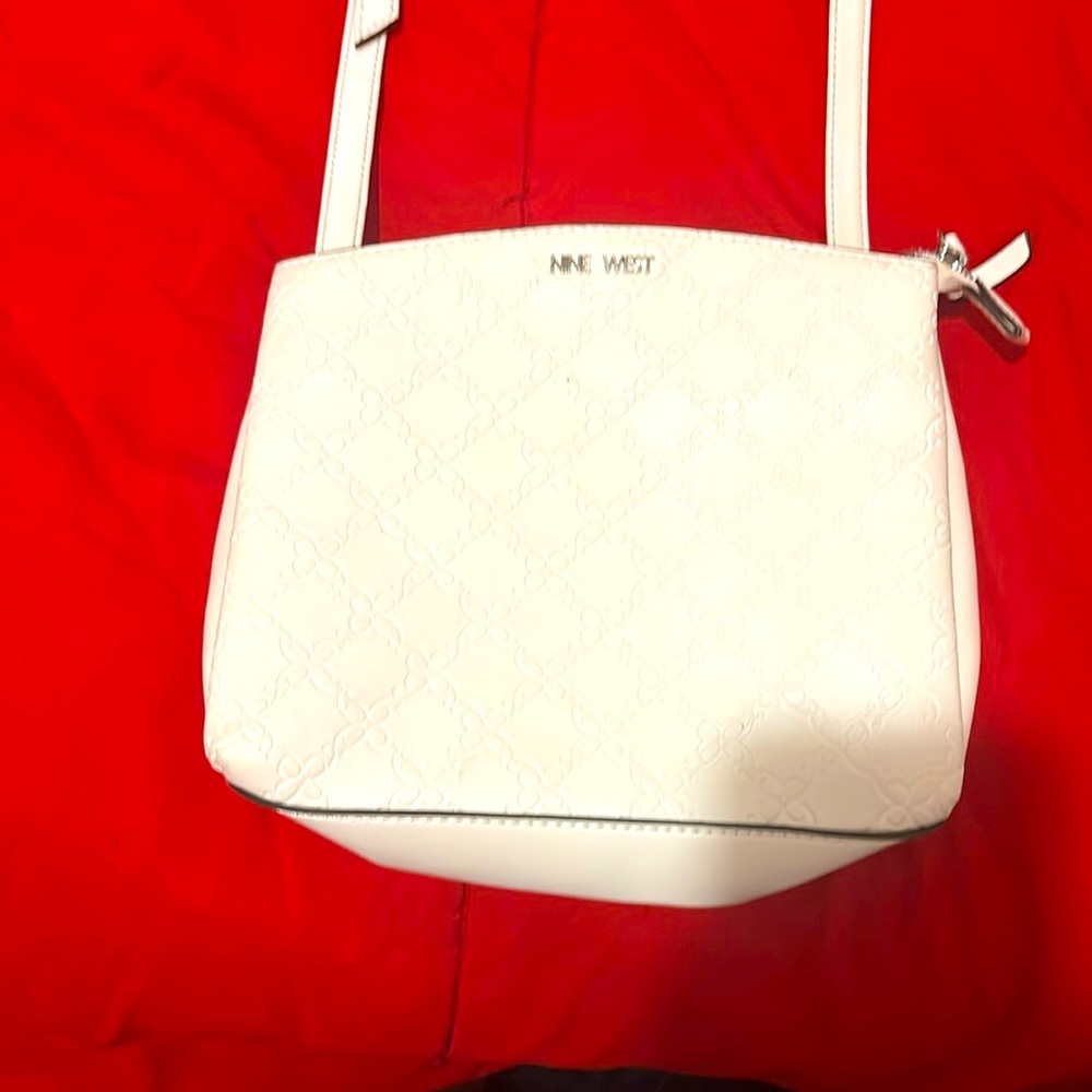 A nice and clean/ beautiful white purse for any occasion.